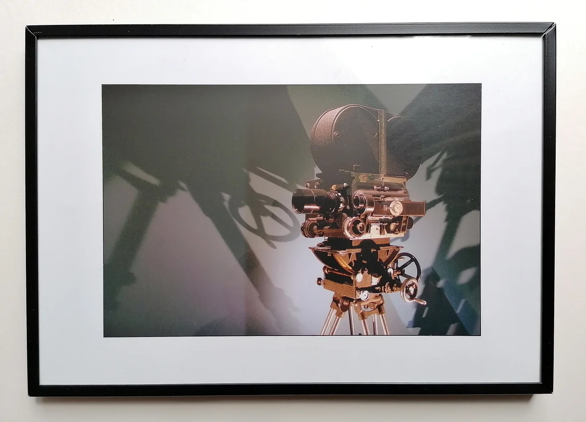 Framed photographic print of a Mitchell movie camera