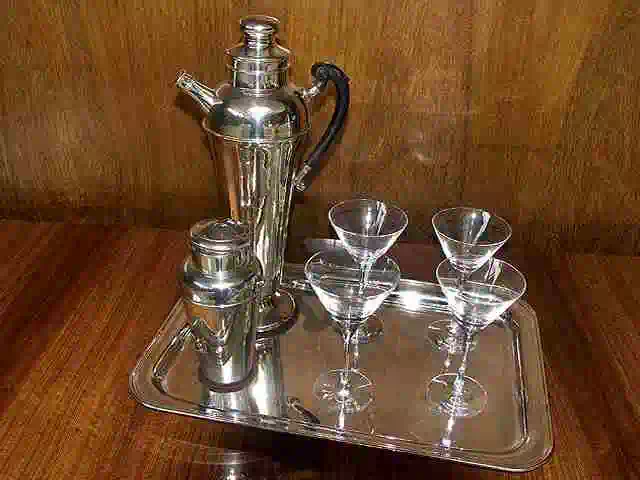 art deco cocktail shaker and glasses on silver tray